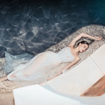 a woman lying in a pool