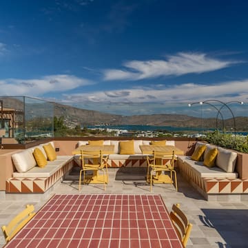 a patio with a table and chairs