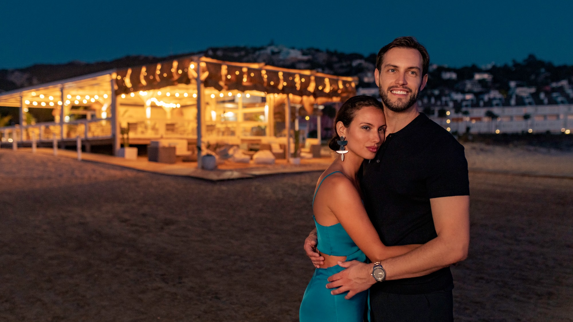 a man and woman posing for a picture