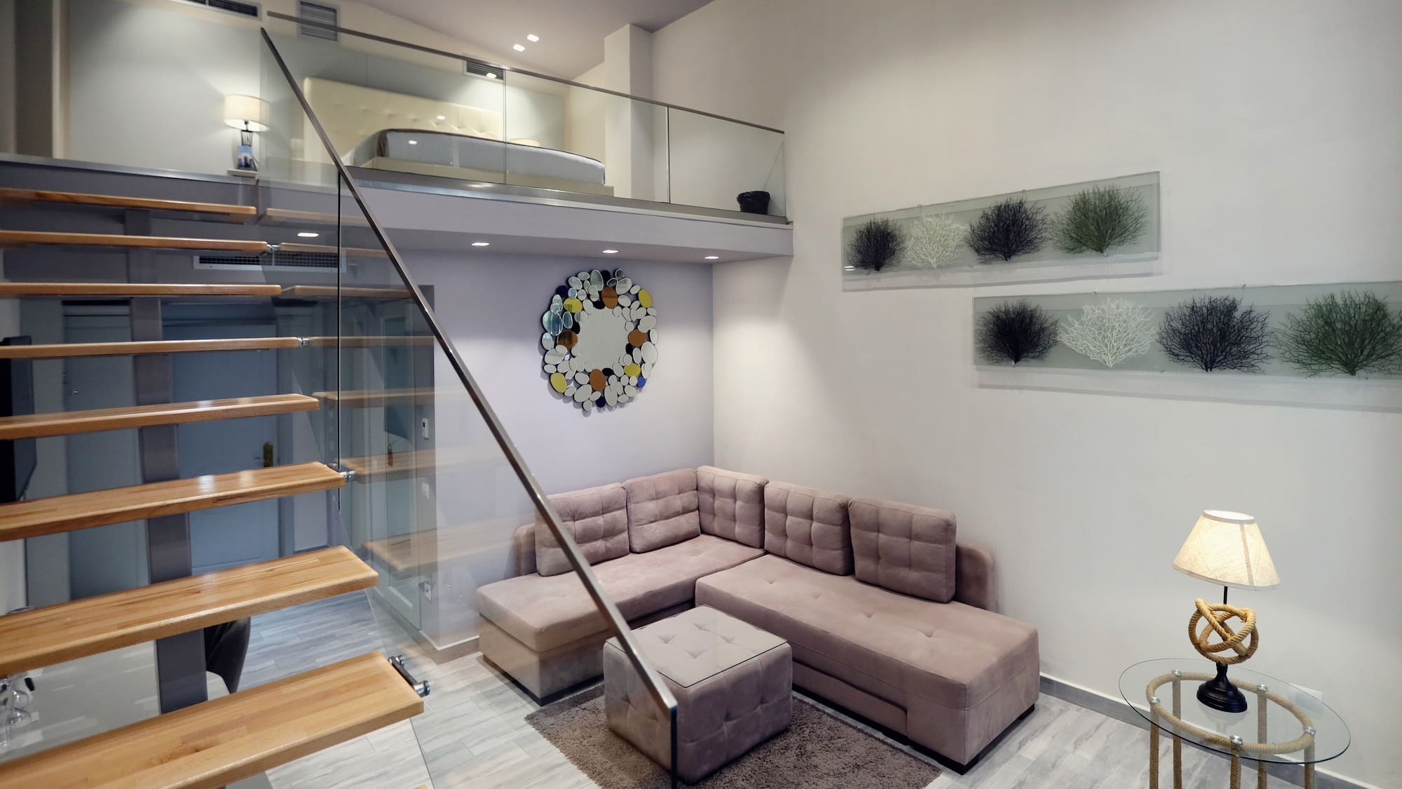 a living room with a couch and stairs