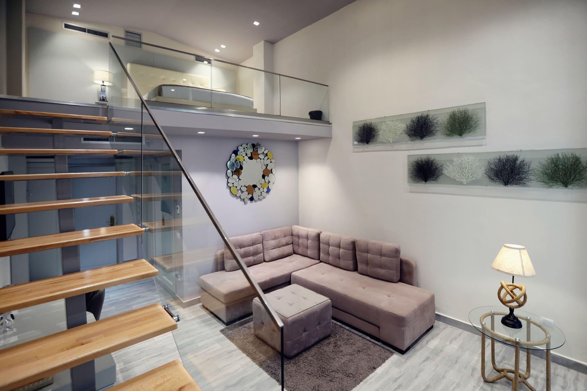 a living room with a couch and stairs