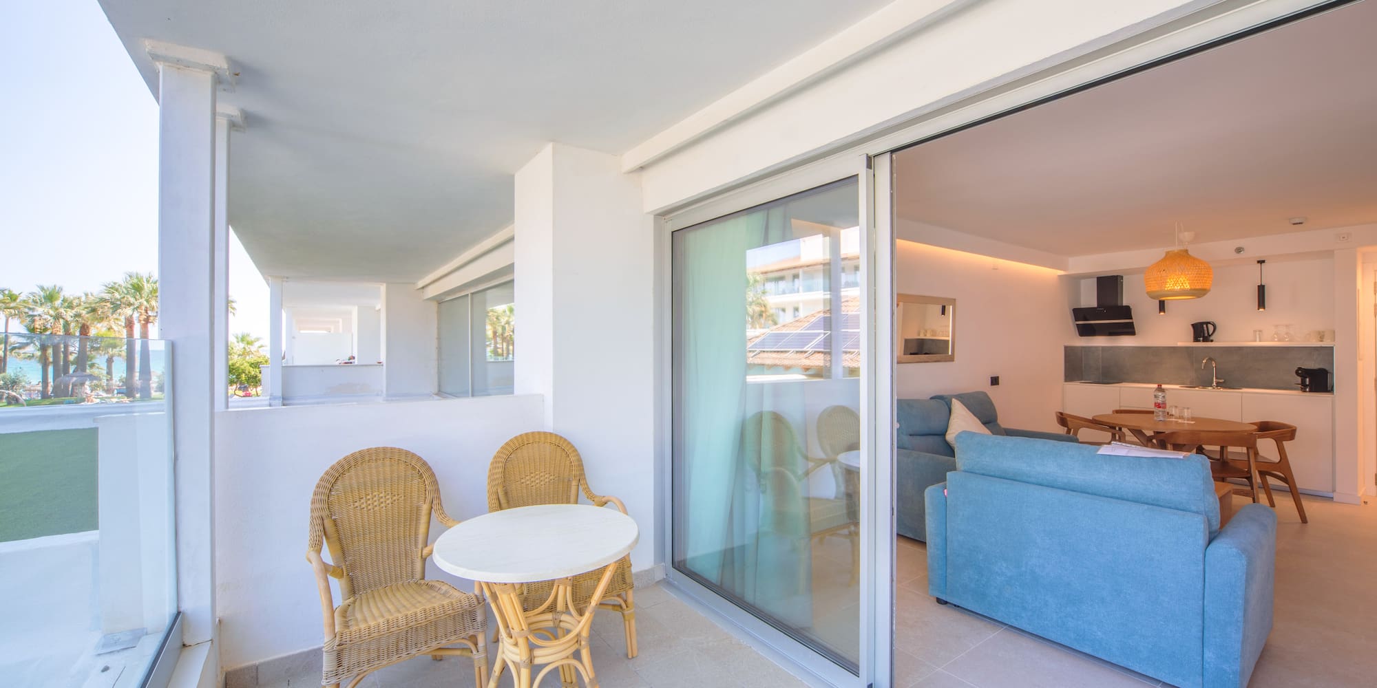 a patio with a table and chairs