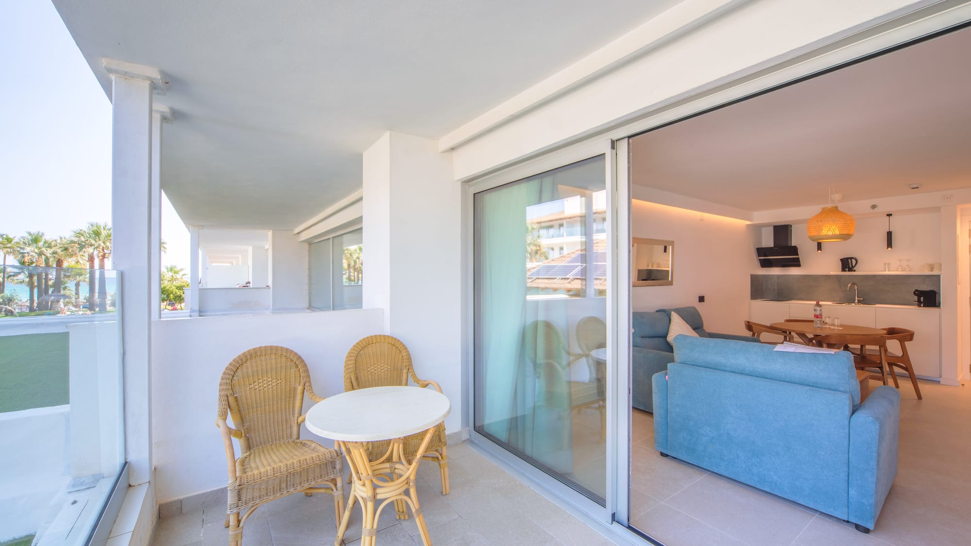 a patio with a table and chairs