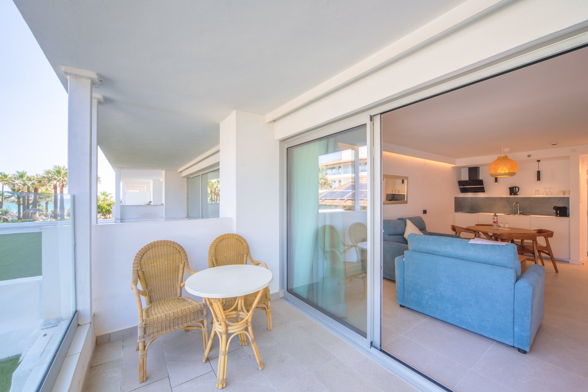 a patio with a table and chairs