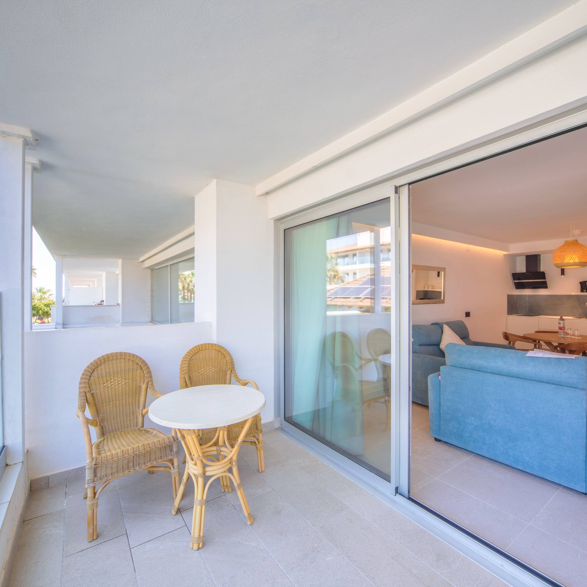 a patio with a table and chairs