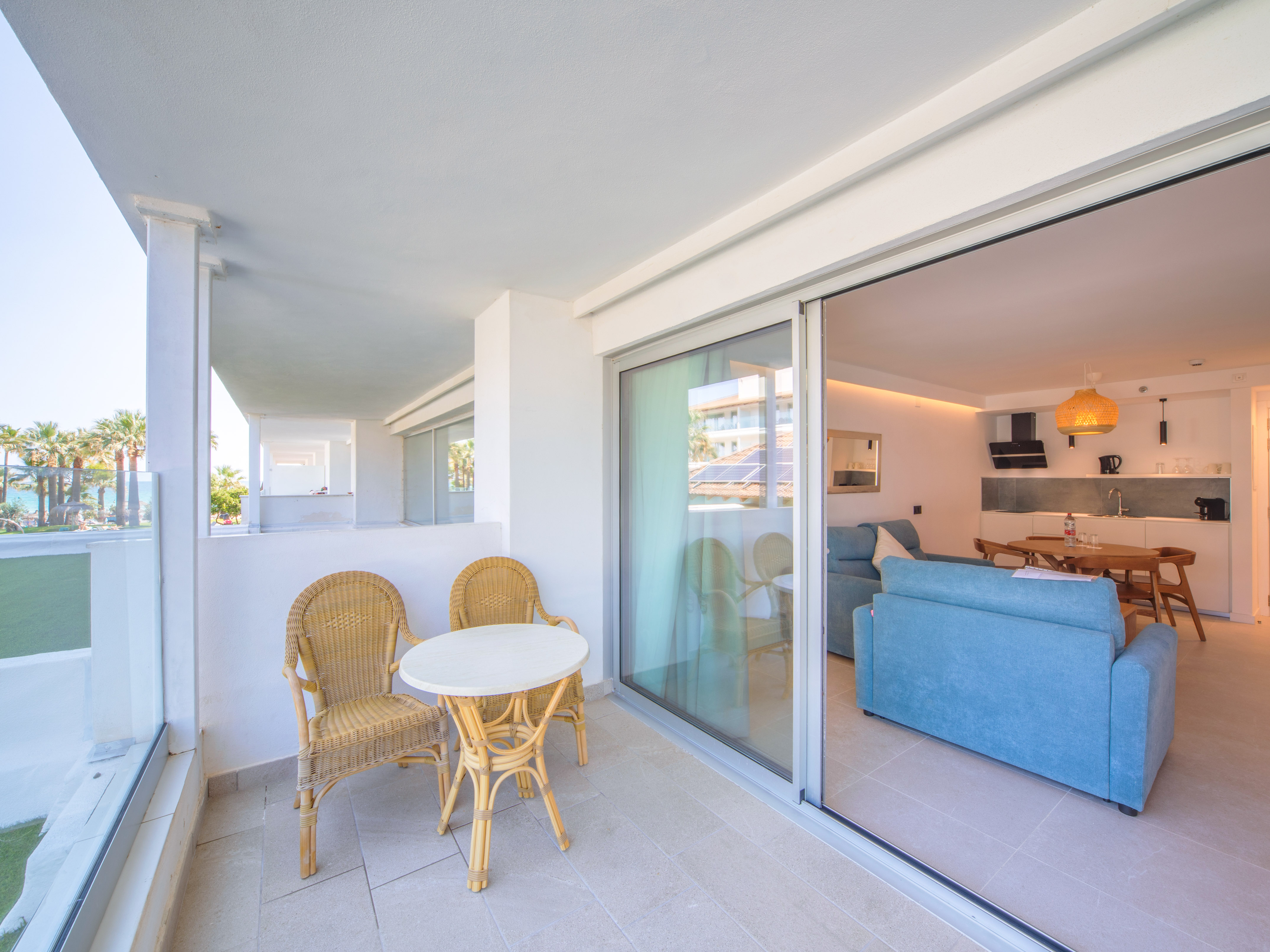 a patio with a table and chairs