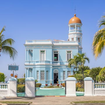 a blue and white building with a gold dome