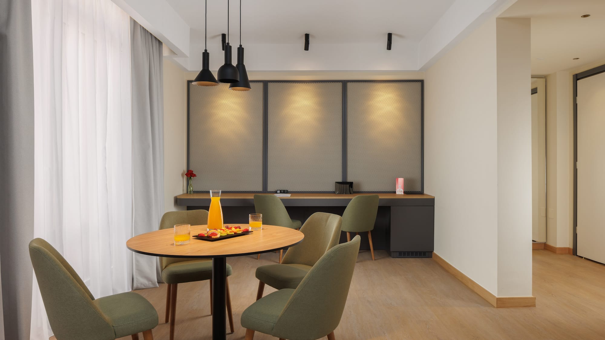 a room with a table and chairs