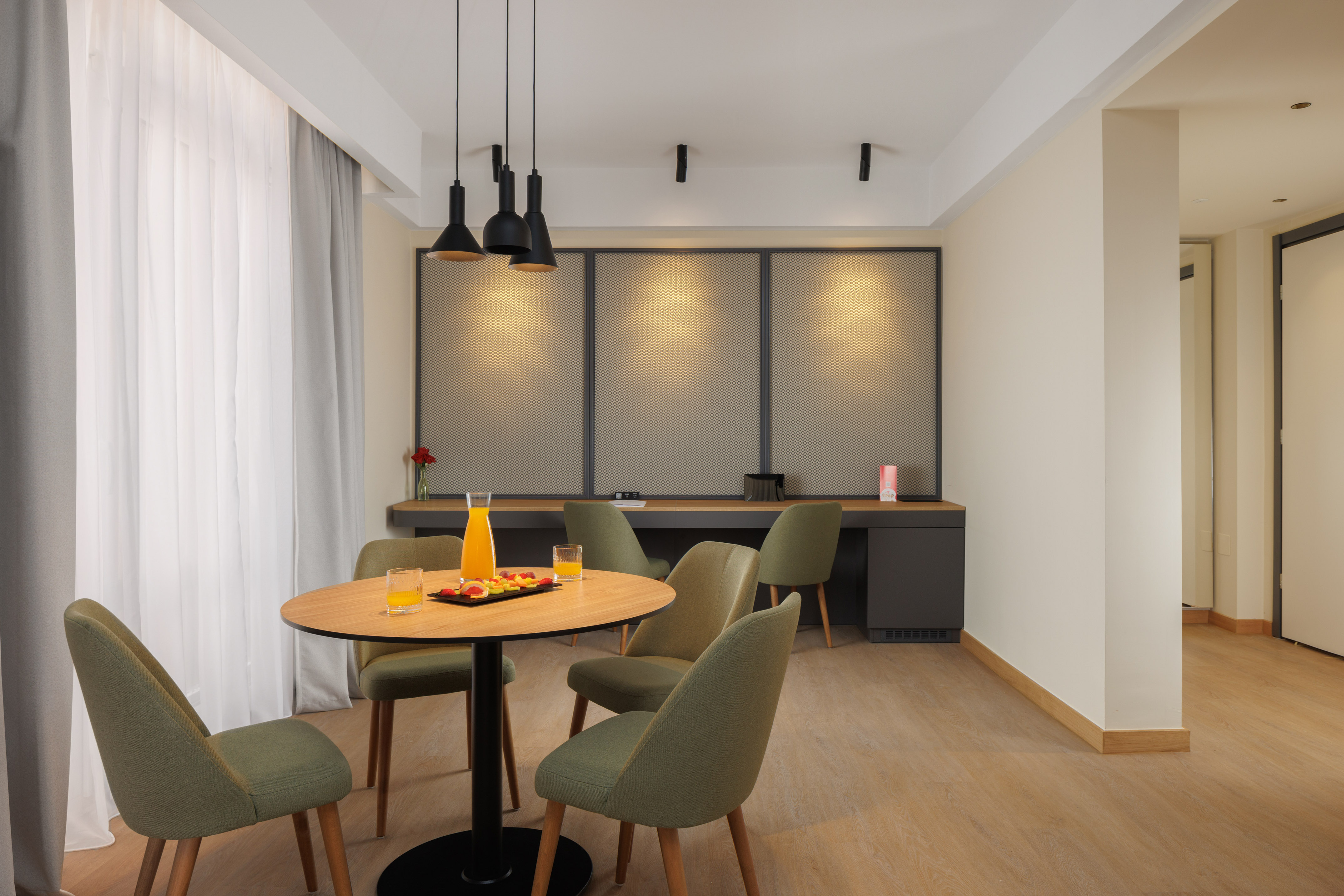 a room with a table and chairs