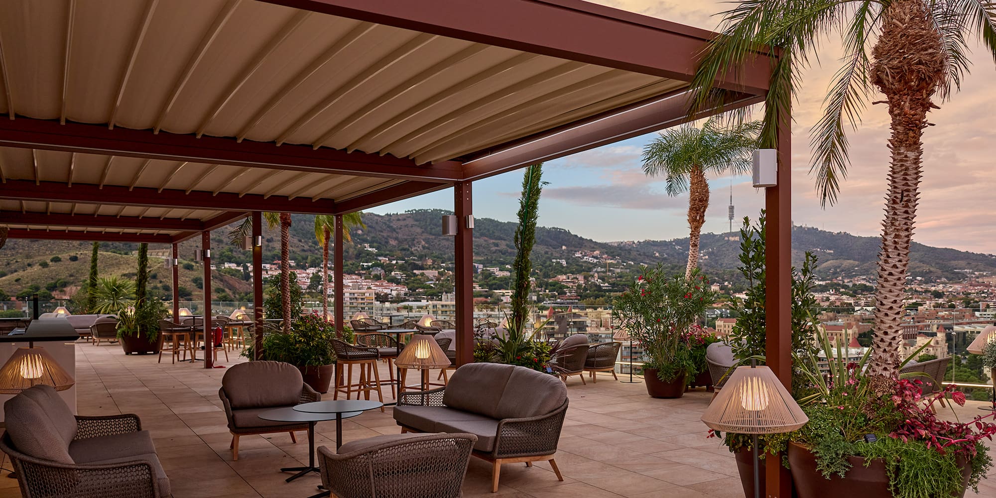 a patio with chairs and tables and plants