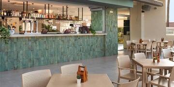 a restaurant with tables and chairs