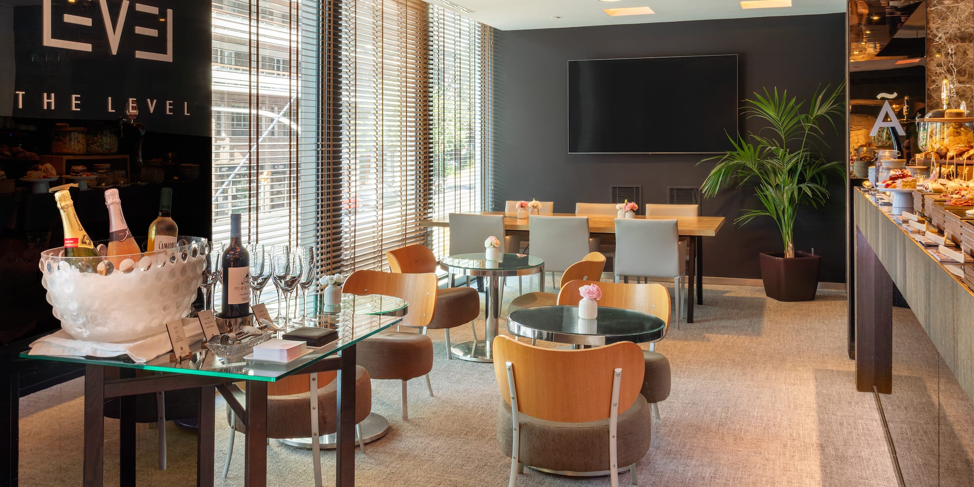 a room with a table and chairs and a television