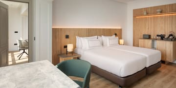 a room with two beds and a table