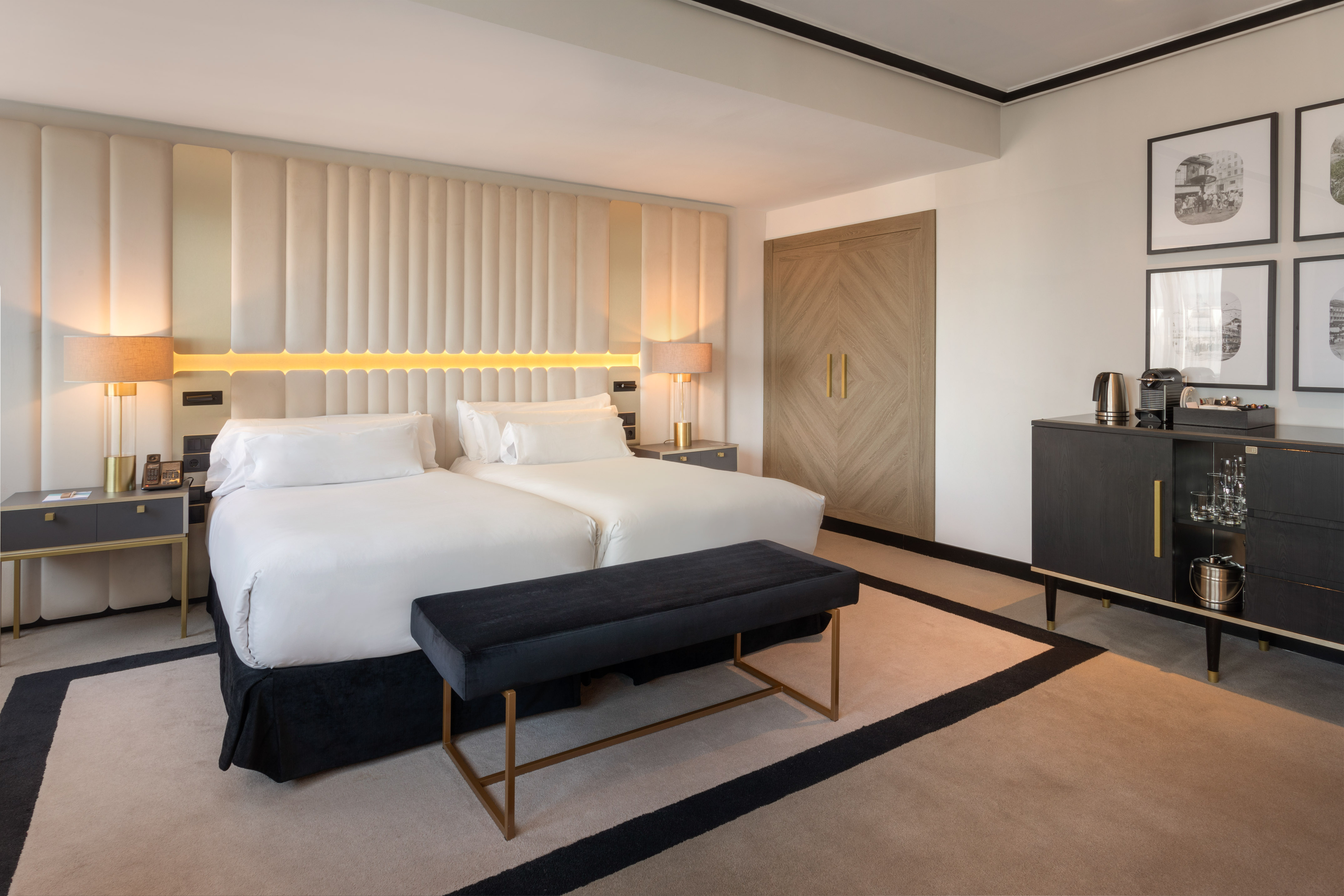 a room with a bed and a bench