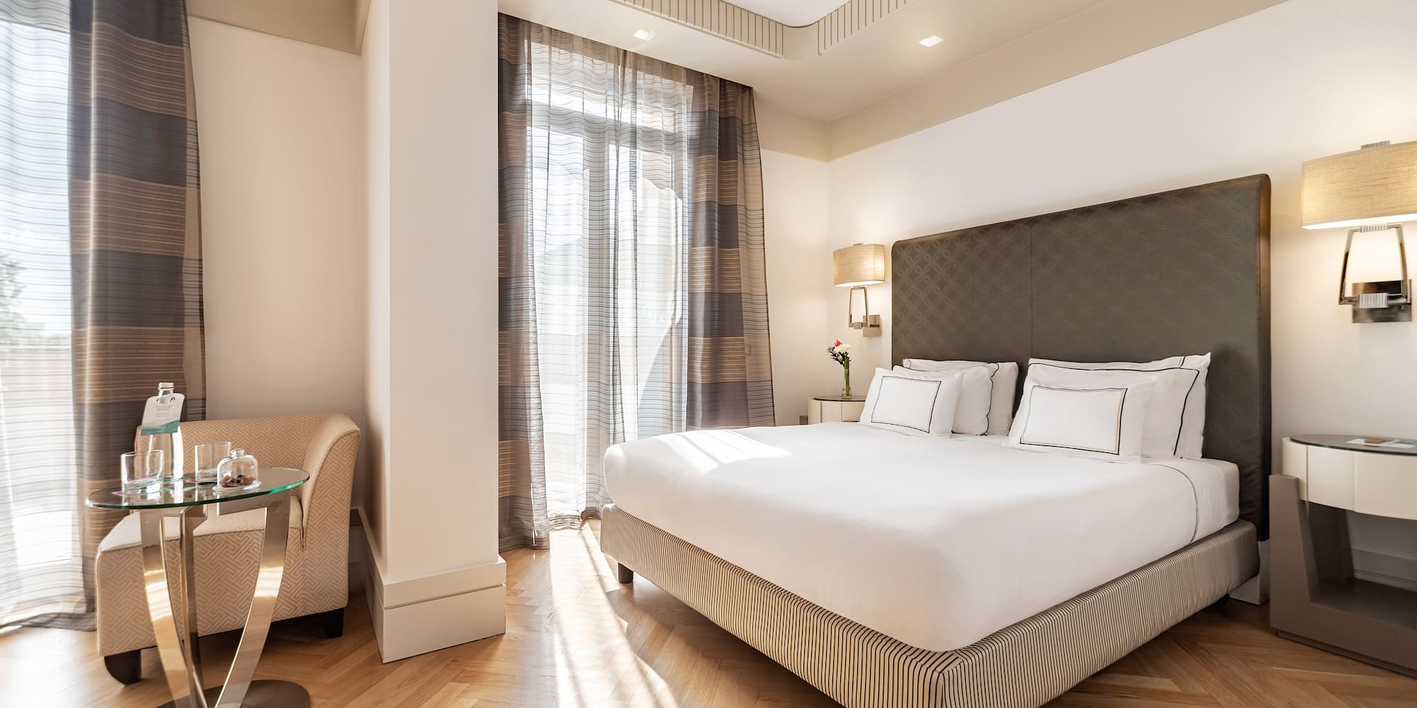 a bedroom with a bed and a table