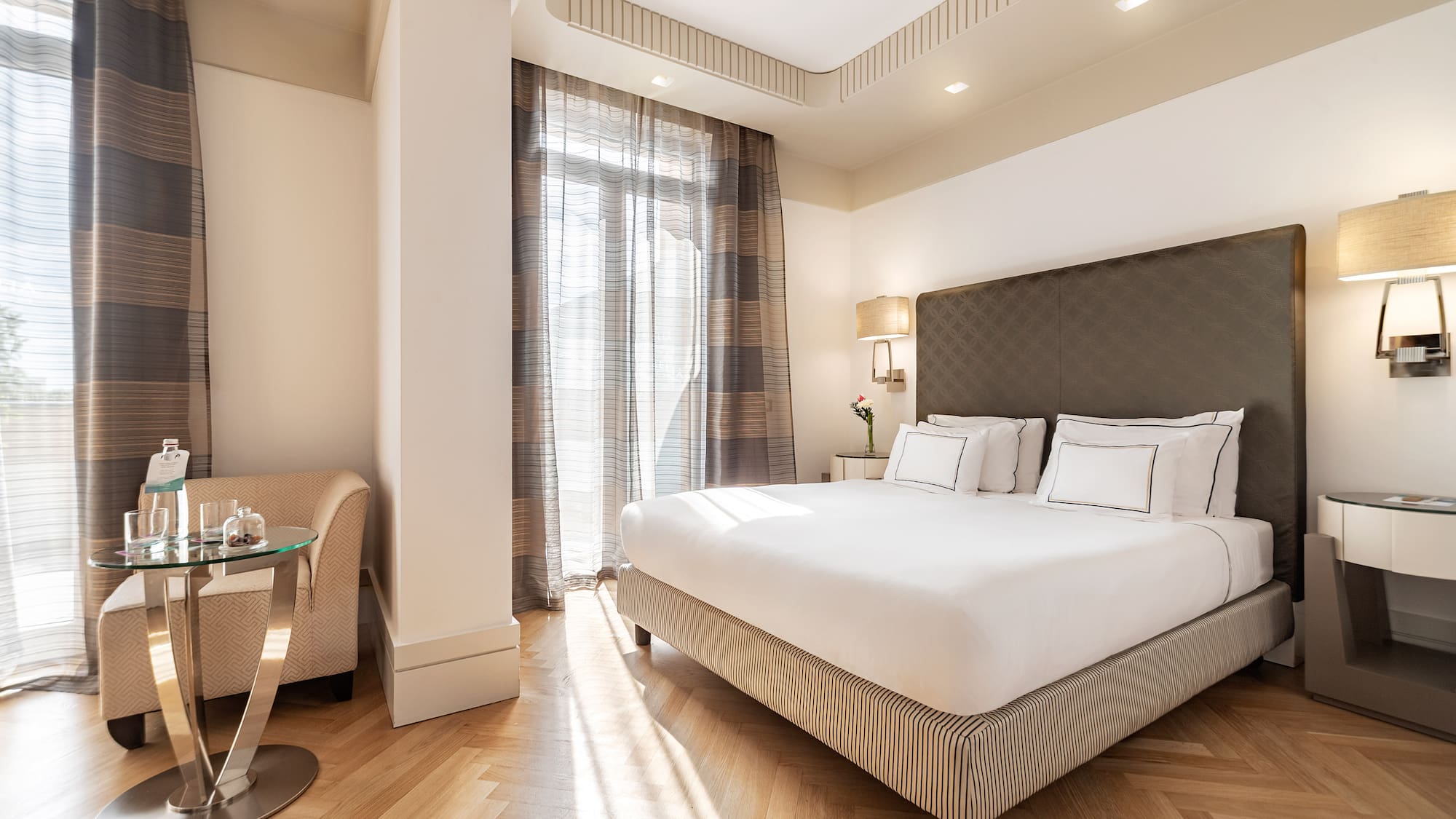 a bedroom with a bed and a table