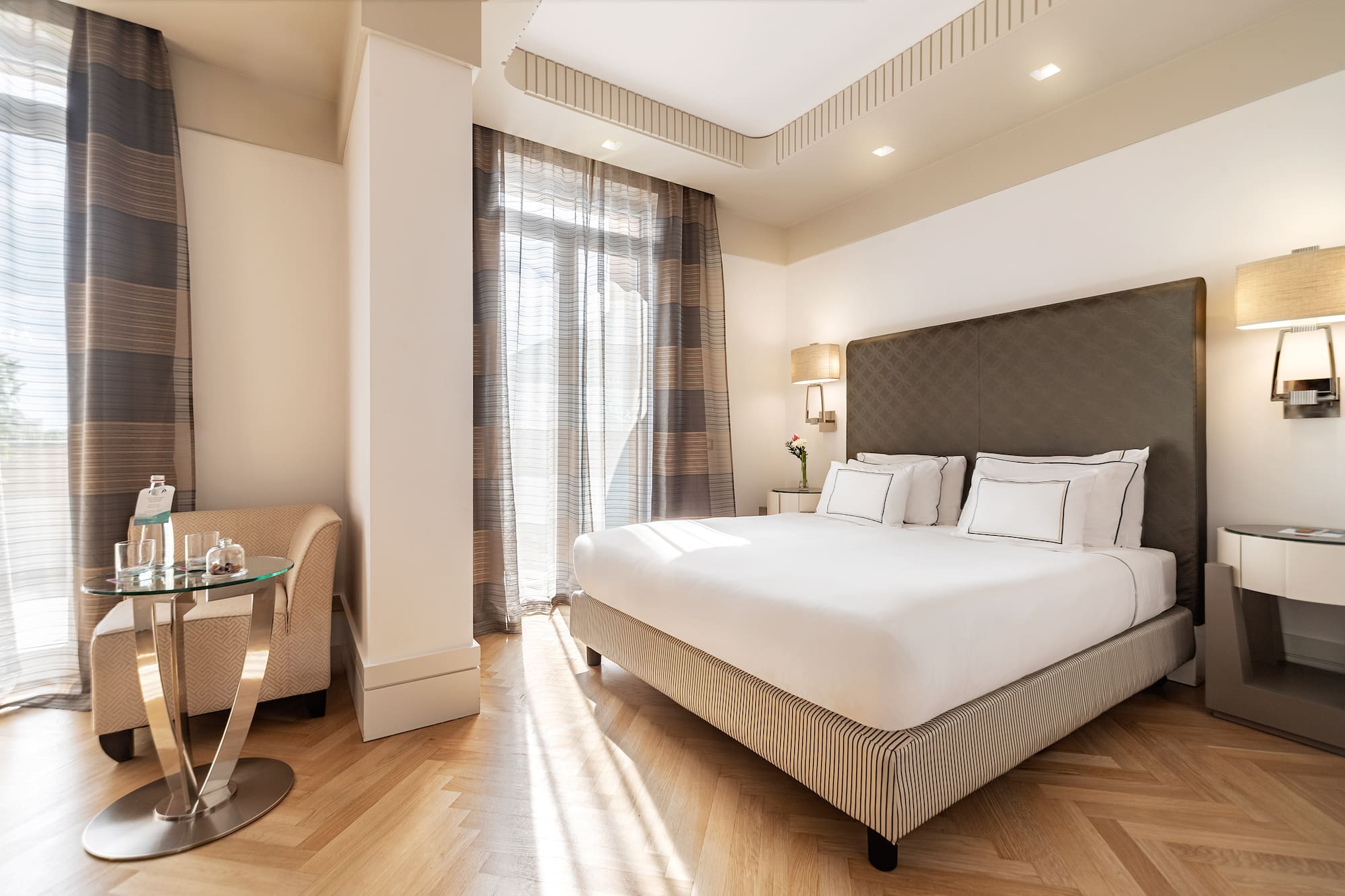 a bedroom with a bed and a table