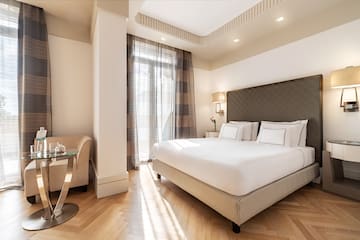 a bedroom with a bed and a table