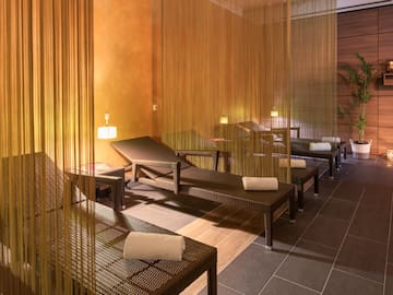 a room with chairs and a curtain