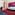 Magenta and pink hotel room with blue bed, red carpet, desk, and sofa.