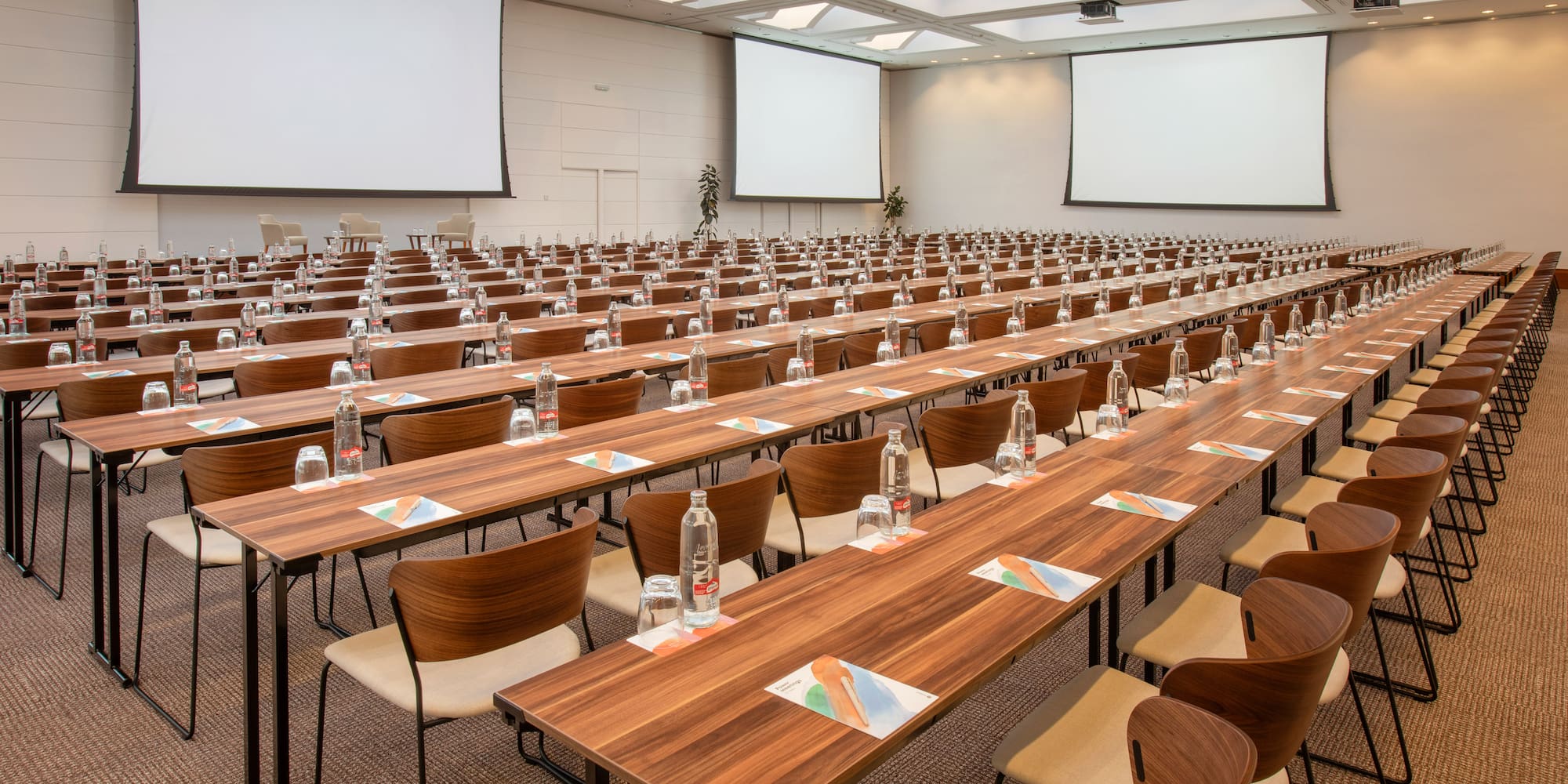a large conference room with tables and chairs