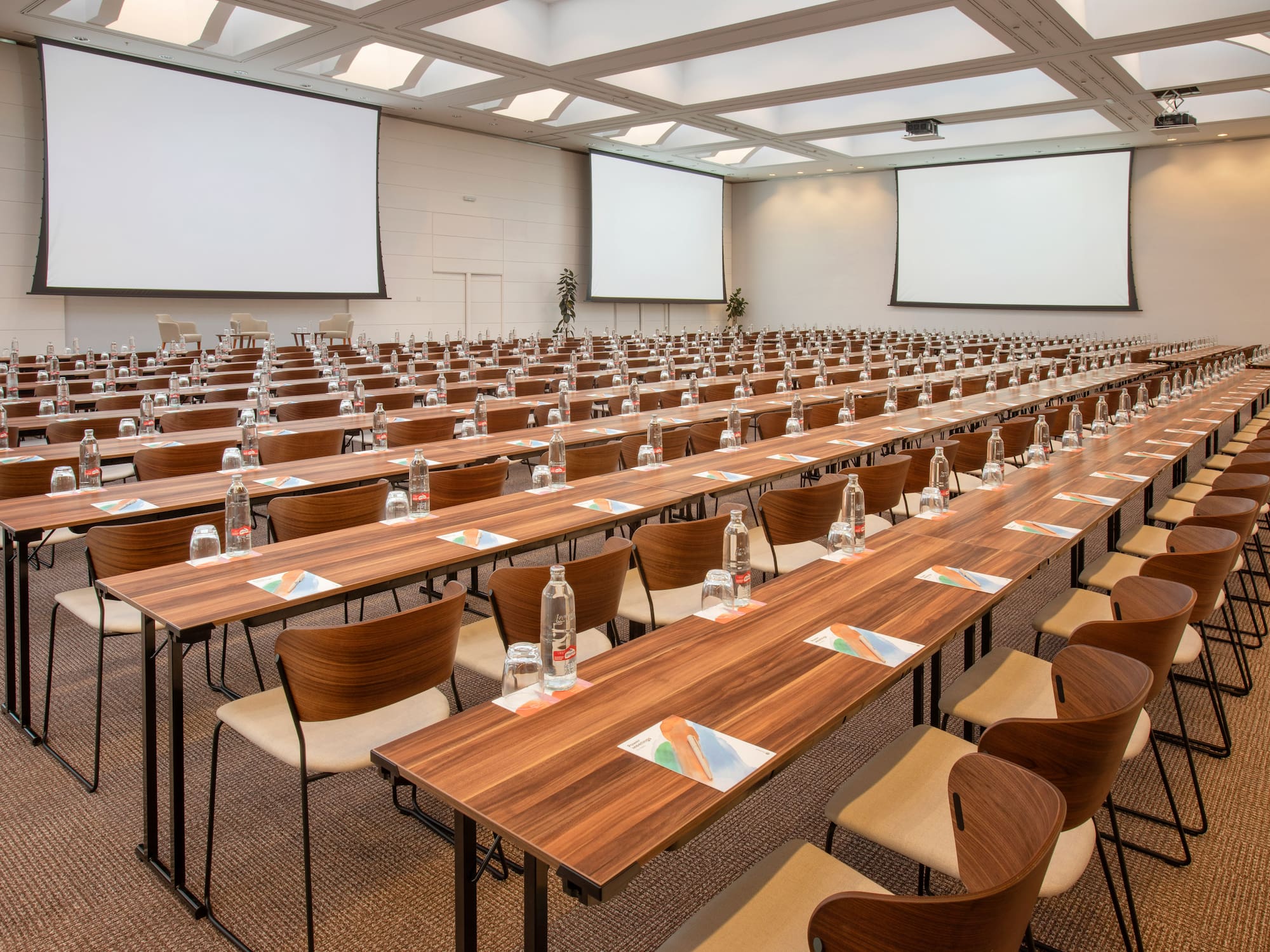 a large conference room with tables and chairs