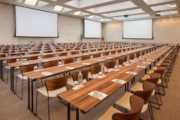 a large conference room with tables and chairs
