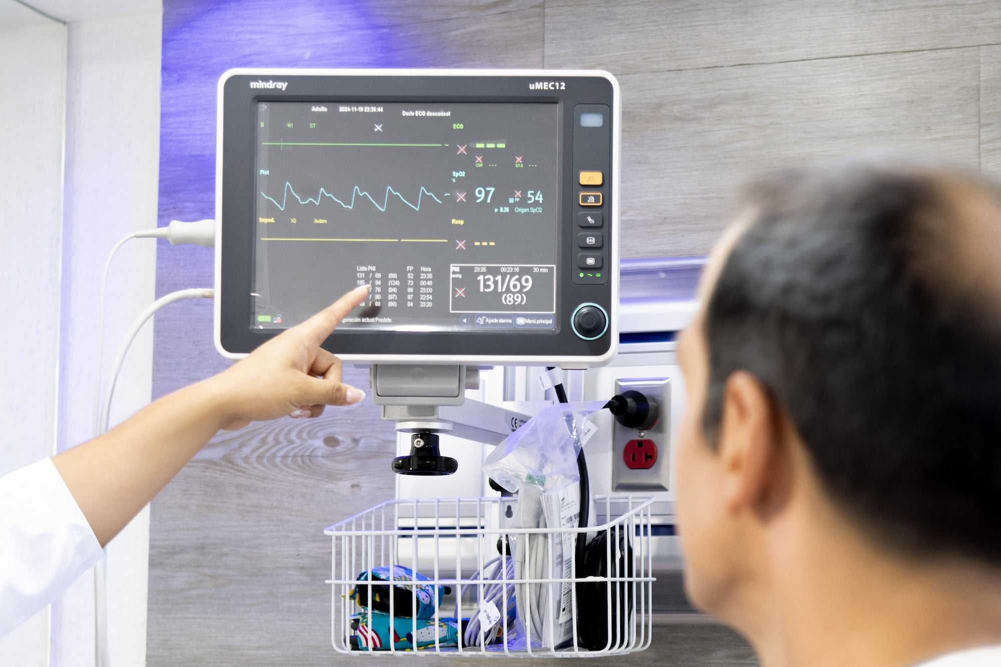 a person pointing at a monitor