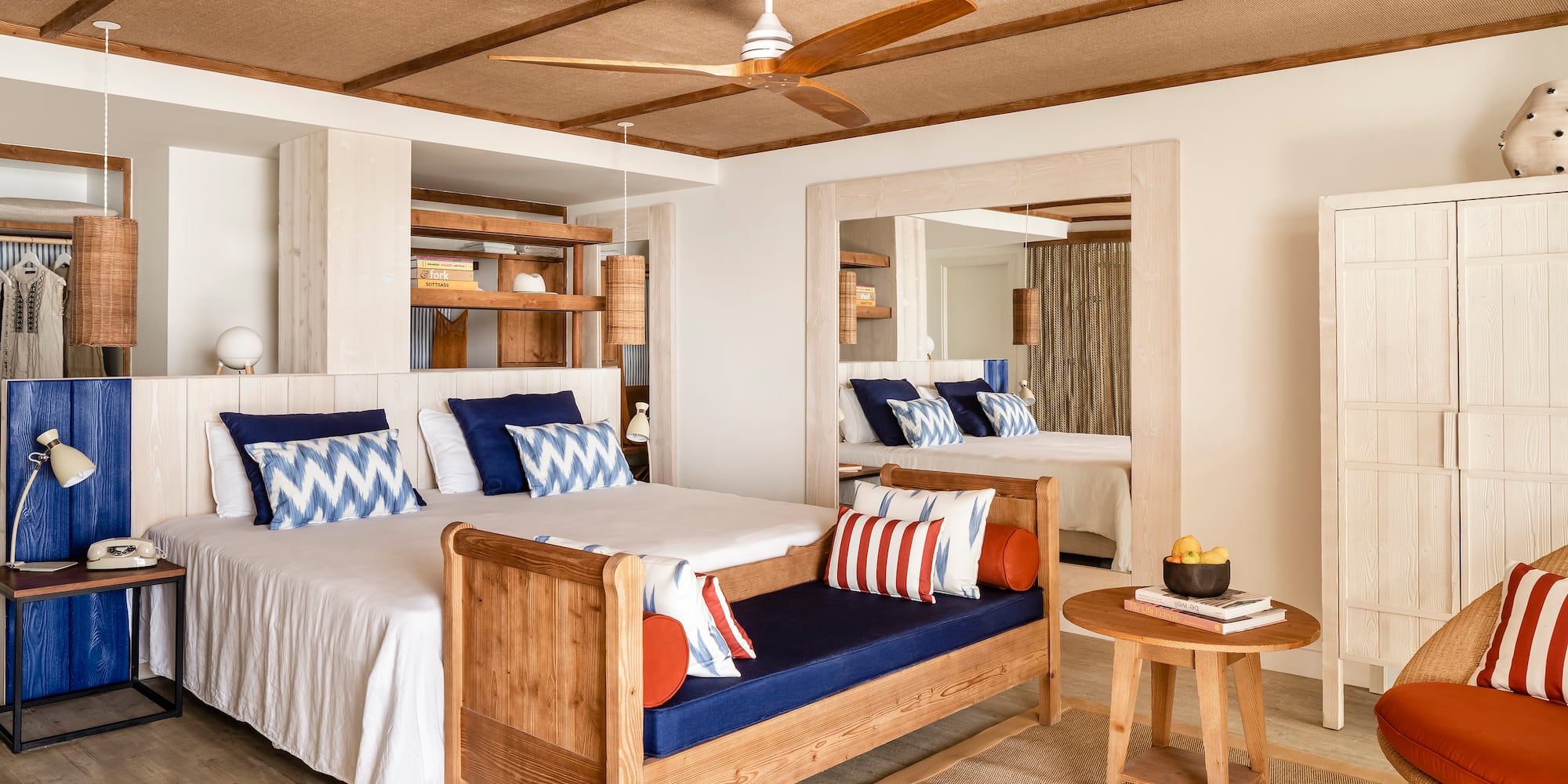 a room with a bed and a fan