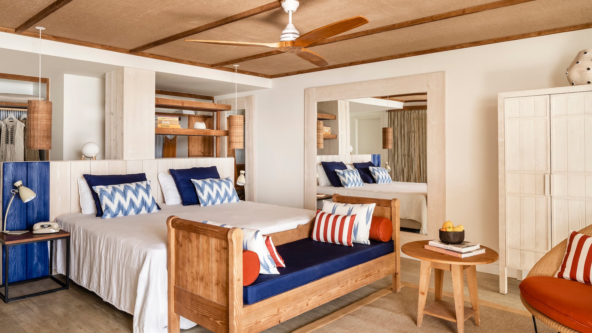 a room with a bed and a fan