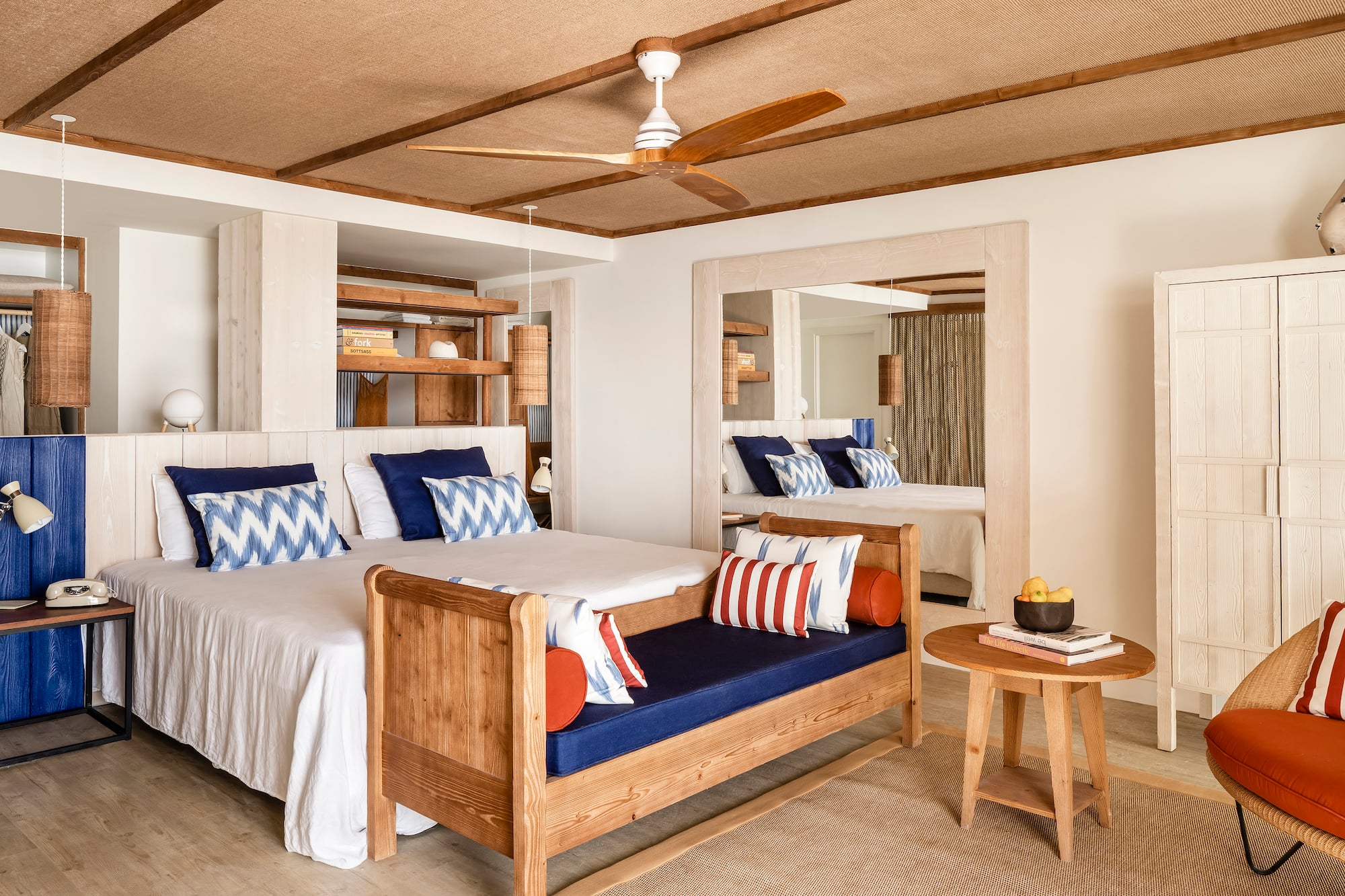 a room with a bed and a fan