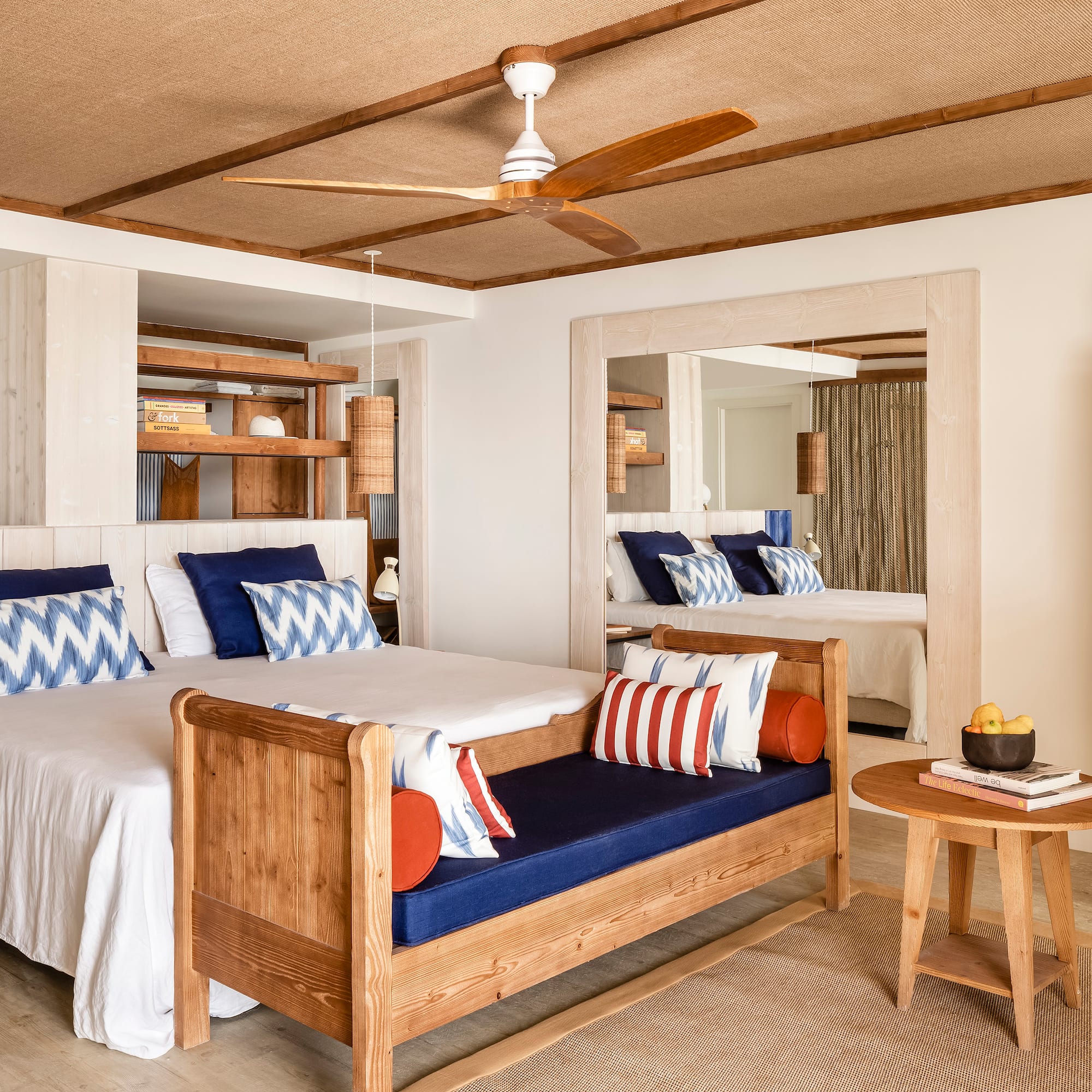 a room with a bed and a fan