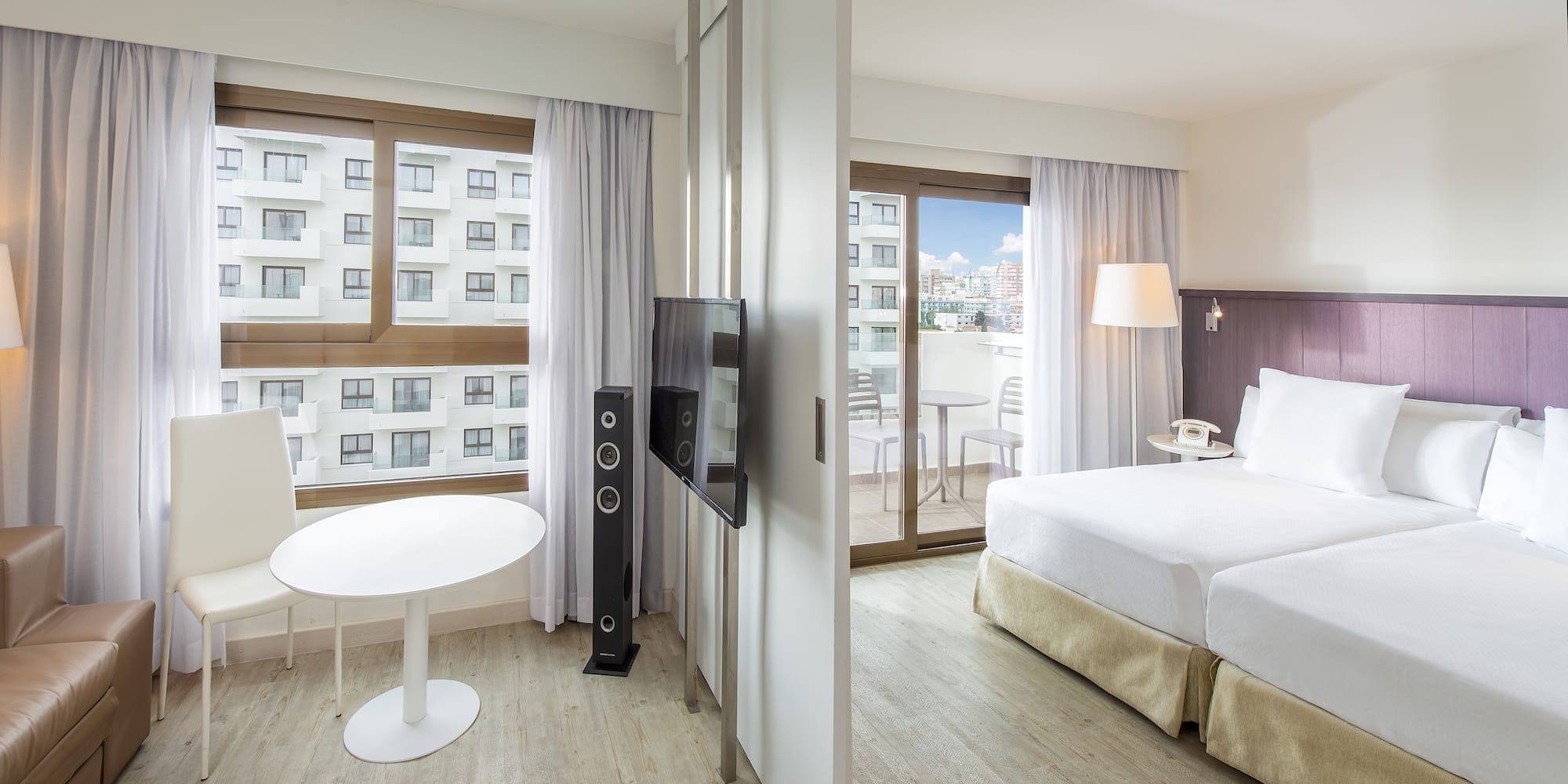 a room with a television and a bed