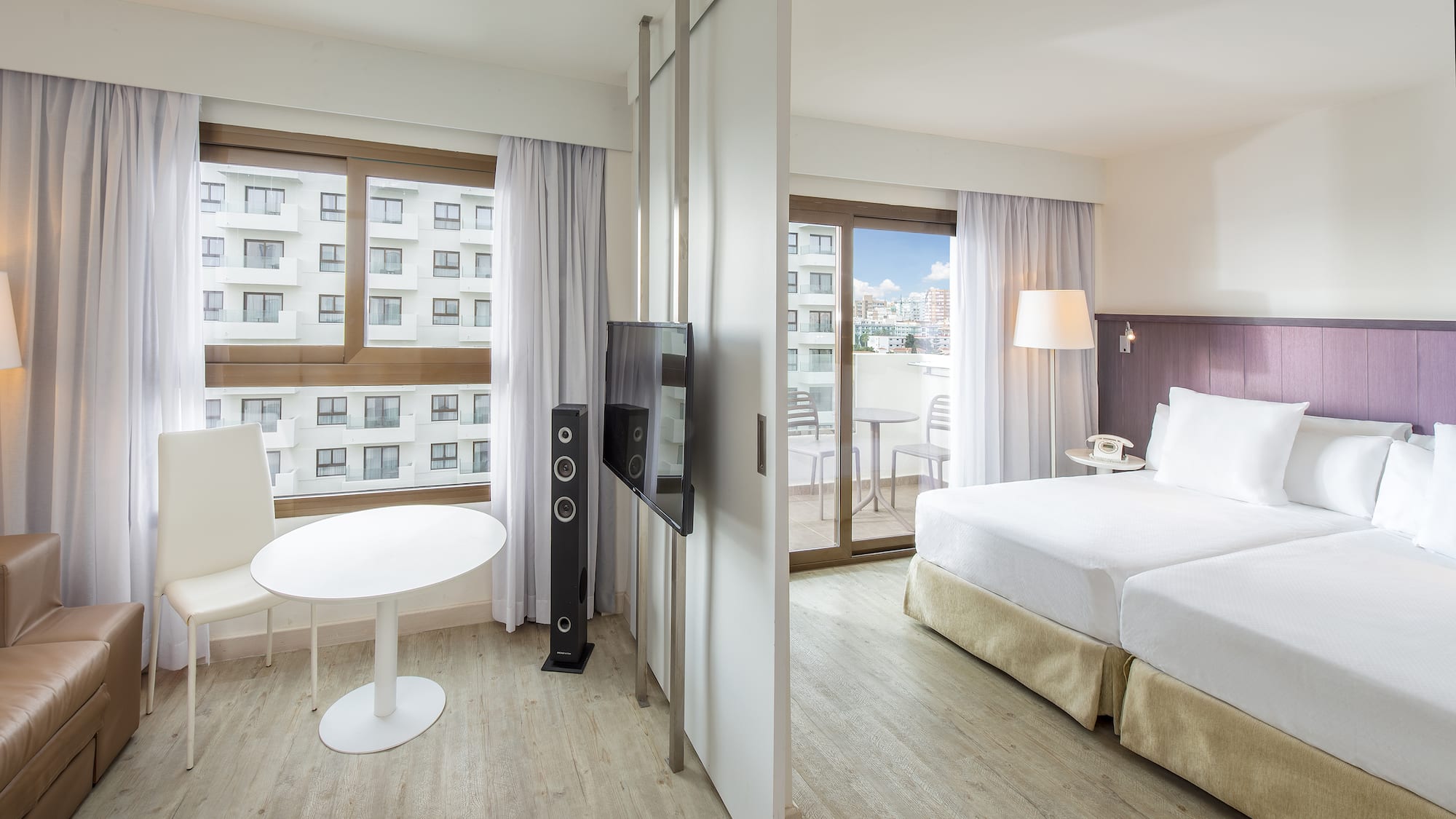 a room with a television and a bed