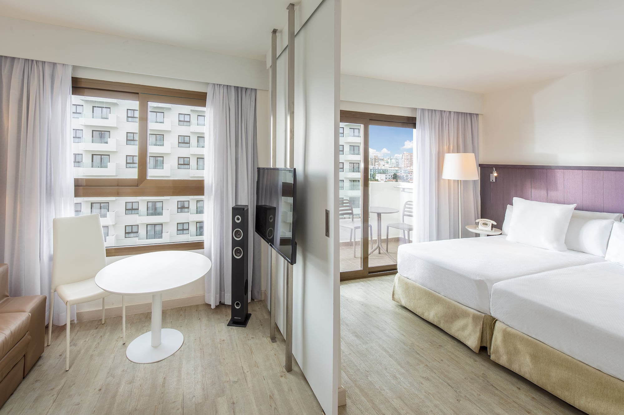 a room with a television and a bed