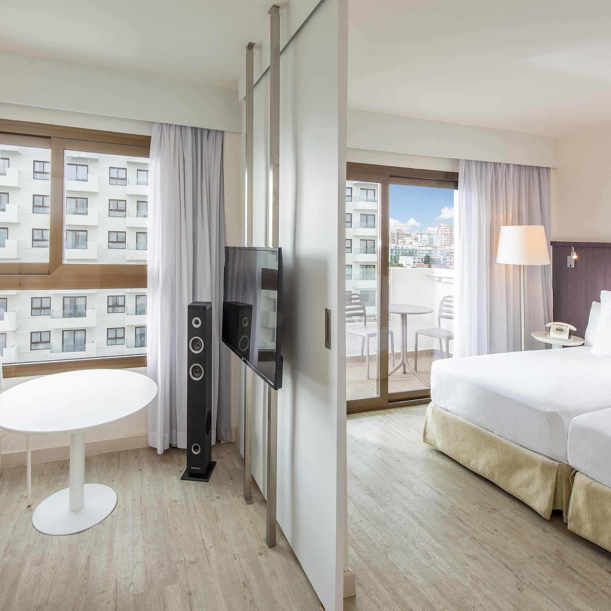 a room with a television and a bed