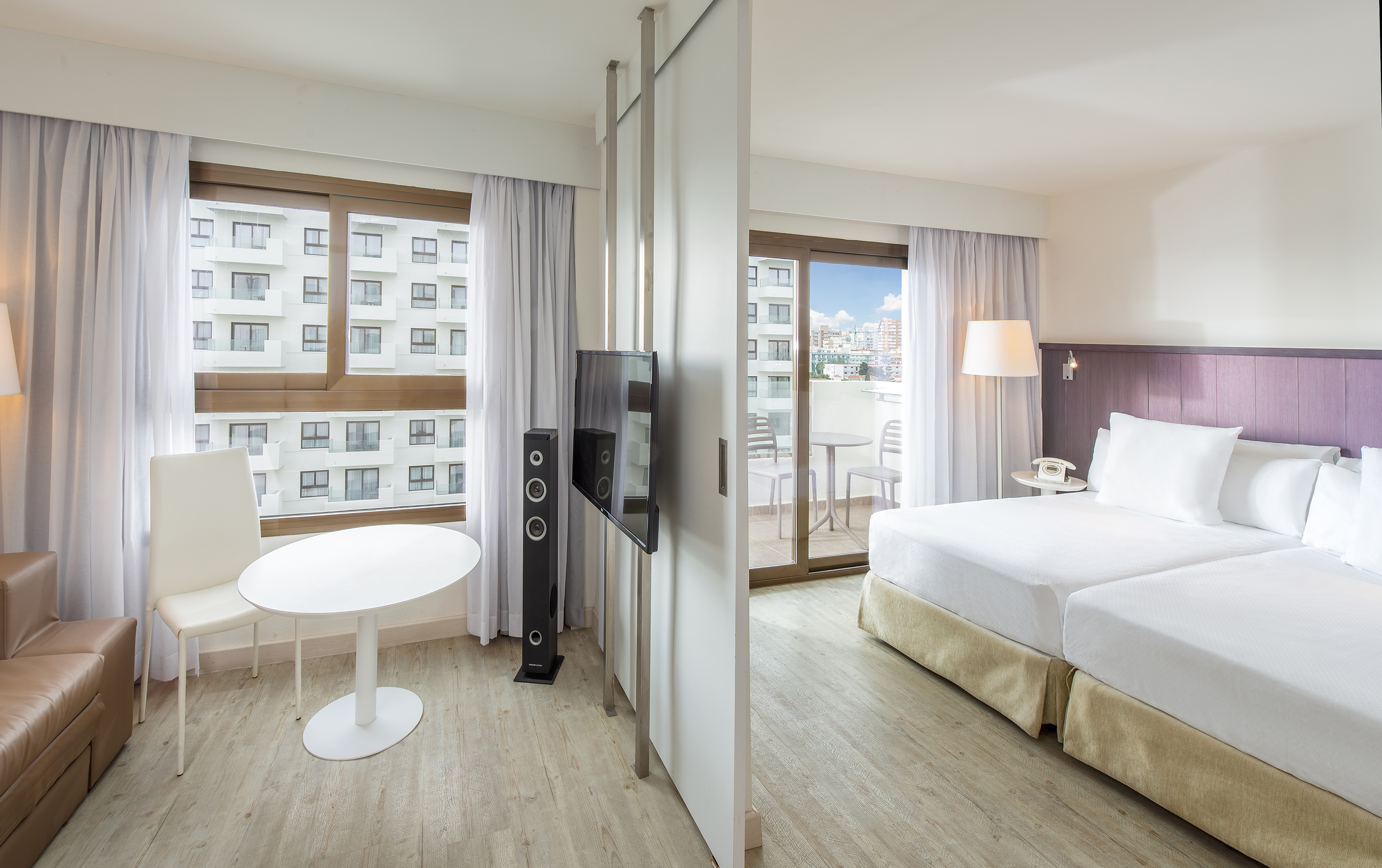 a room with a television and a bed