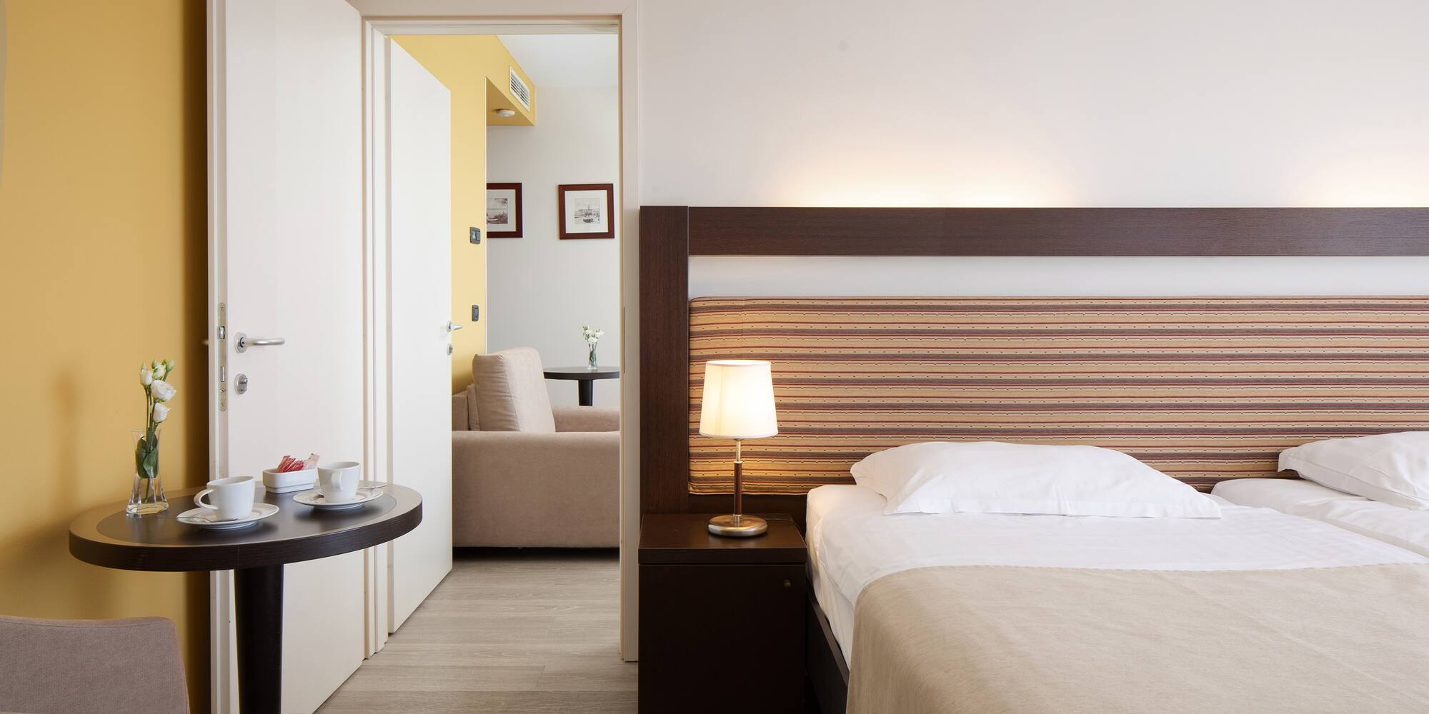 a bedroom with a bed and a table