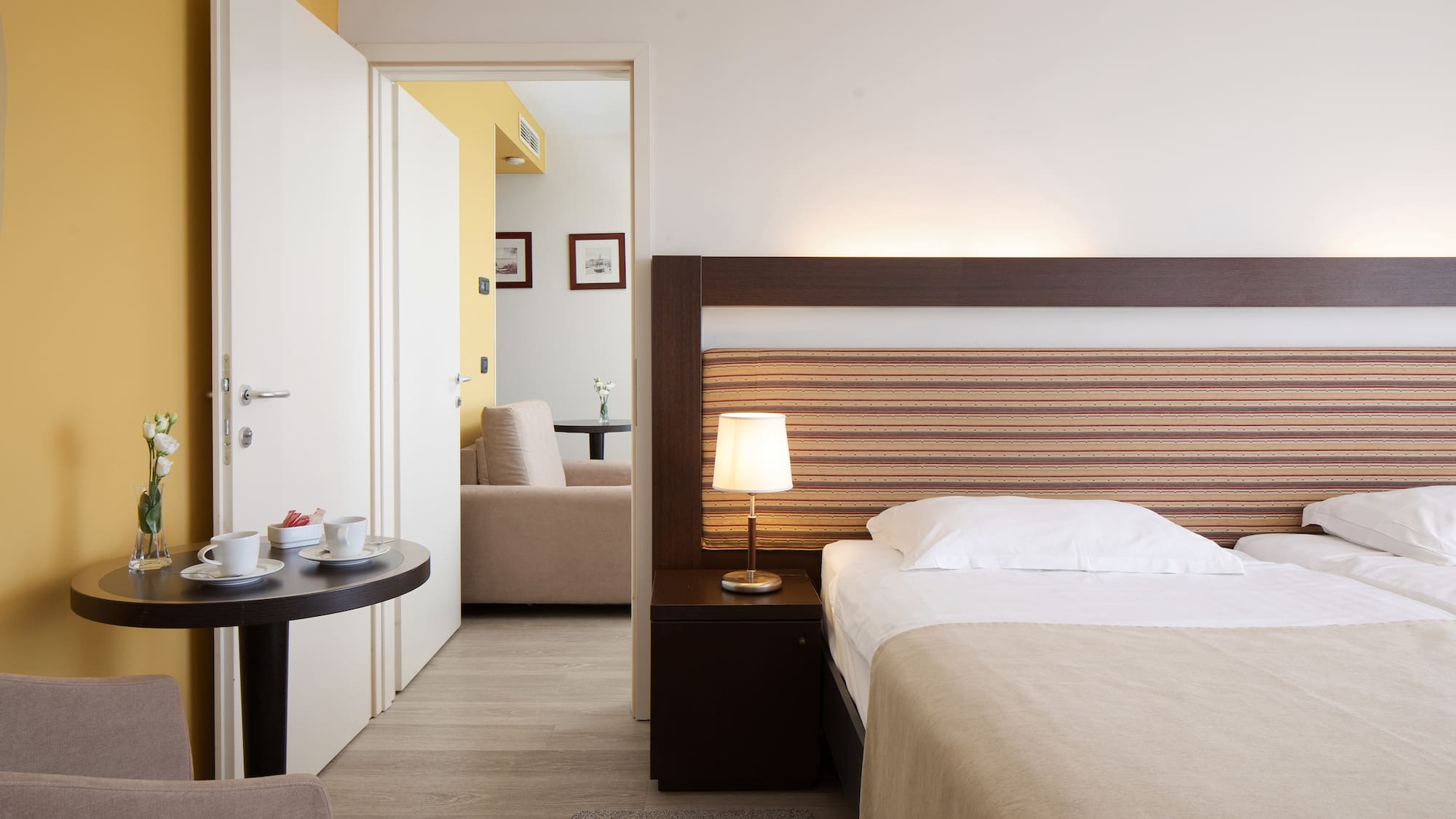 a bedroom with a bed and a table