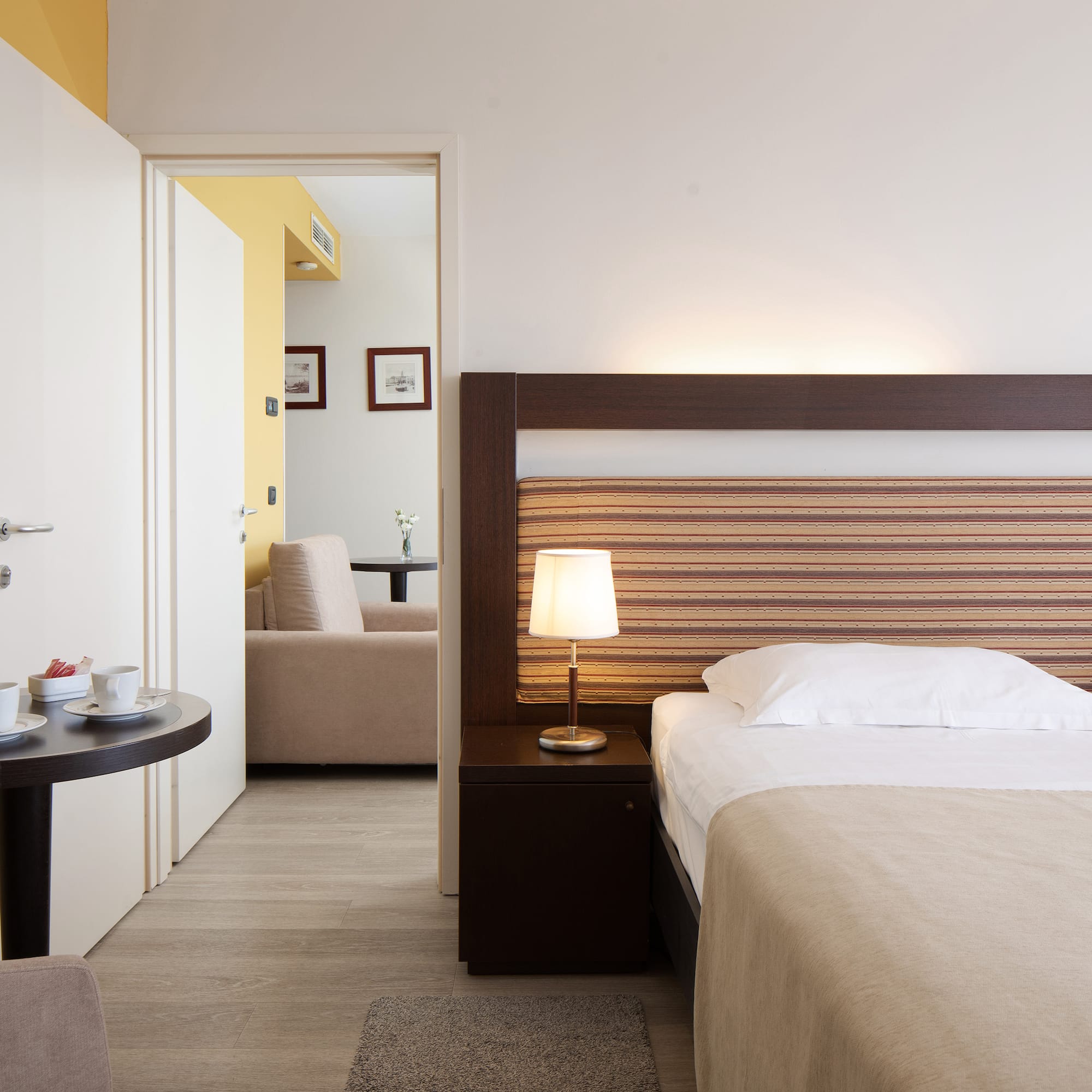 a bedroom with a bed and a table