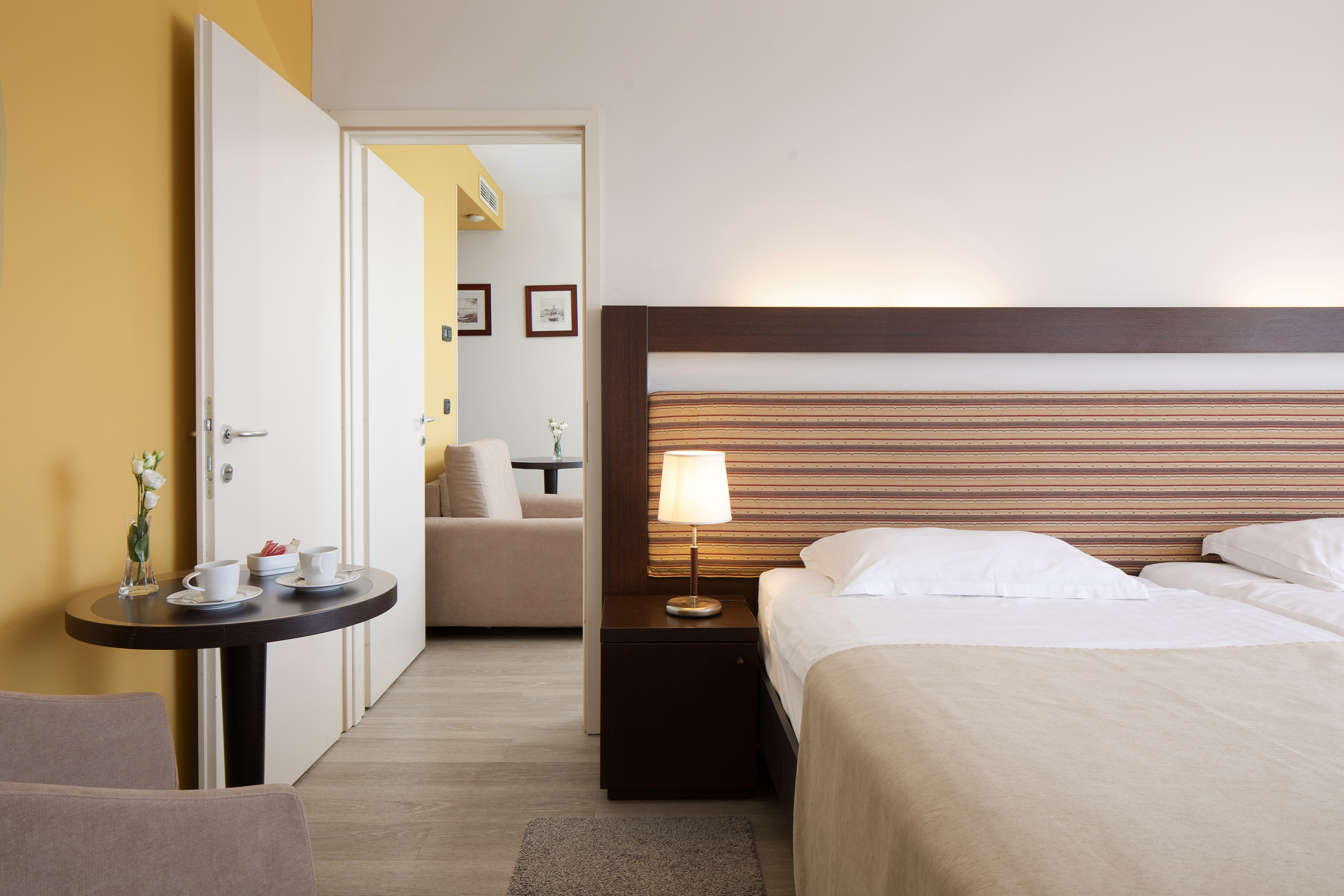 a bedroom with a bed and a table