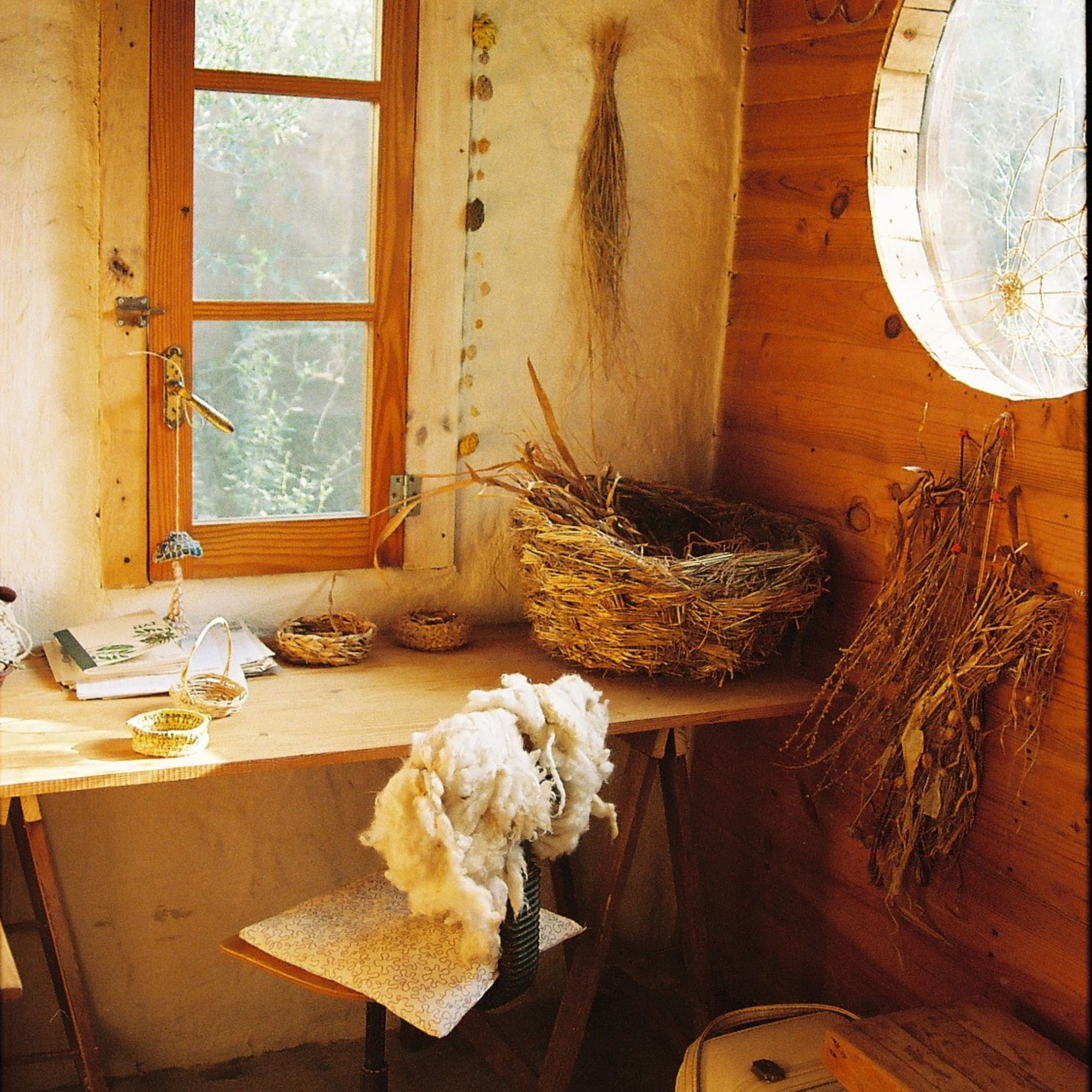 a room with a table and a chair and a basket
