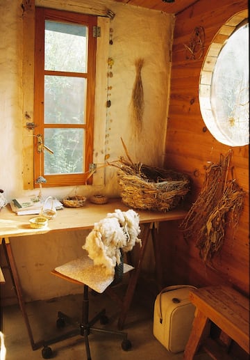 a room with a table and a chair and a basket