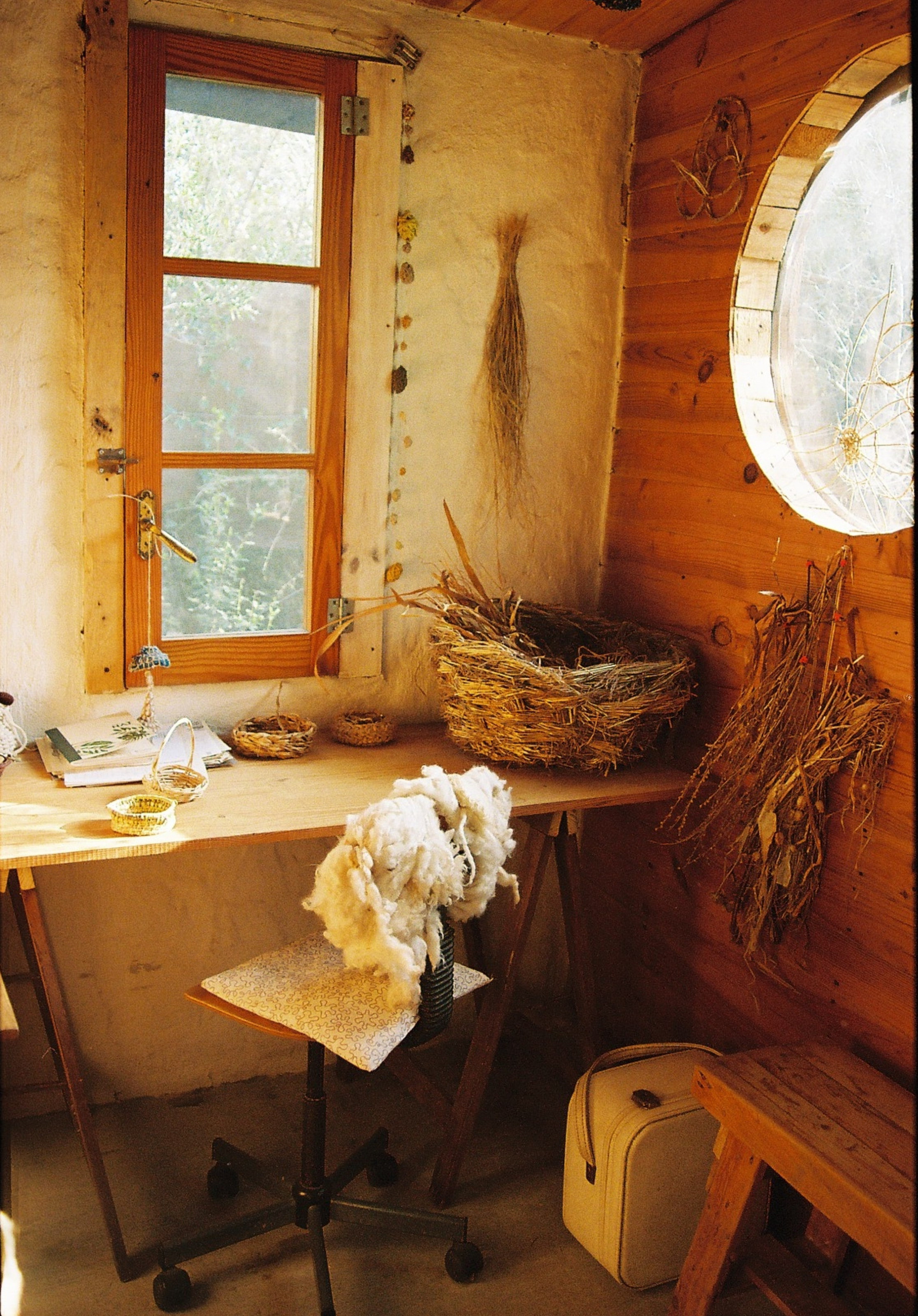 a room with a table and a chair and a basket