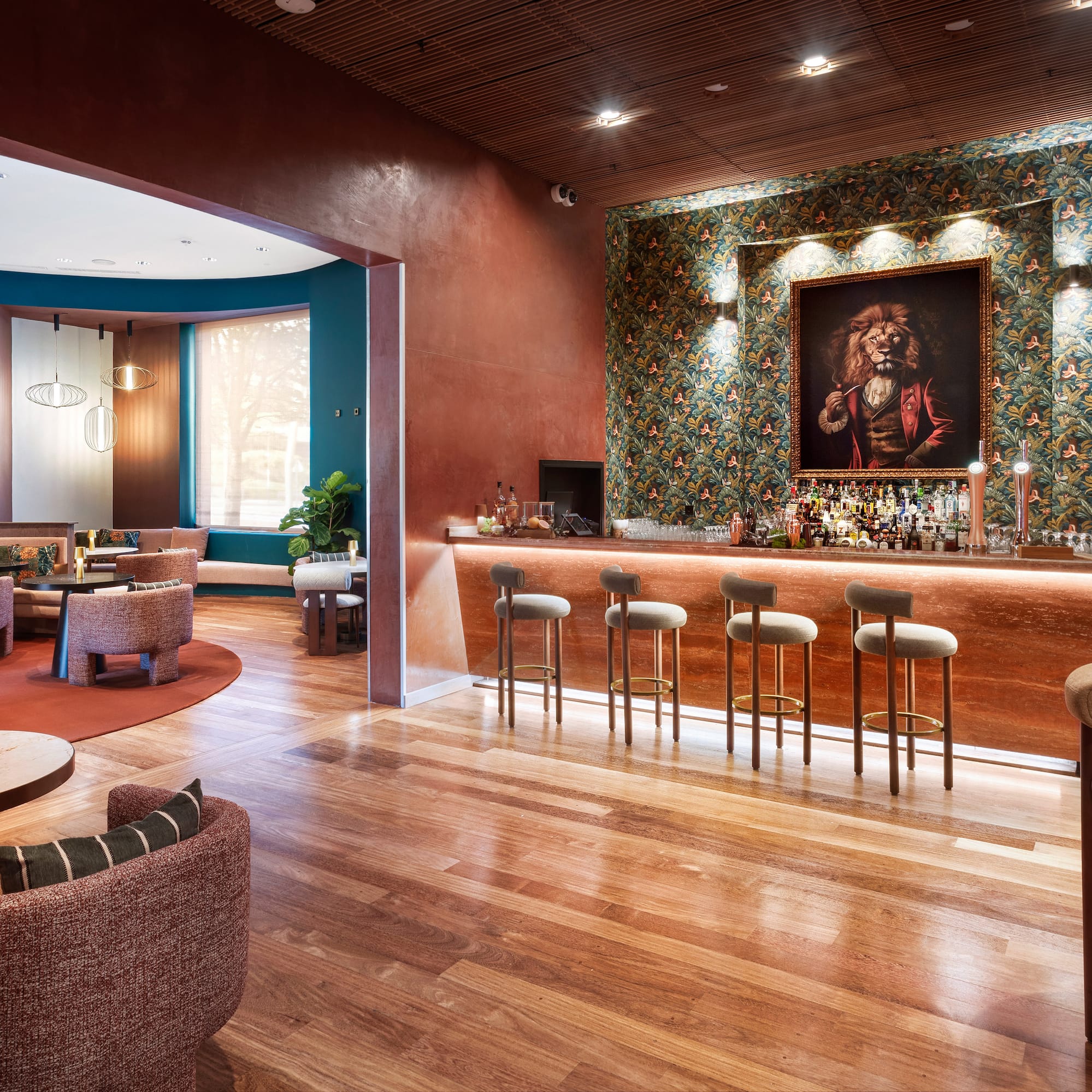 a room with a bar and chairs