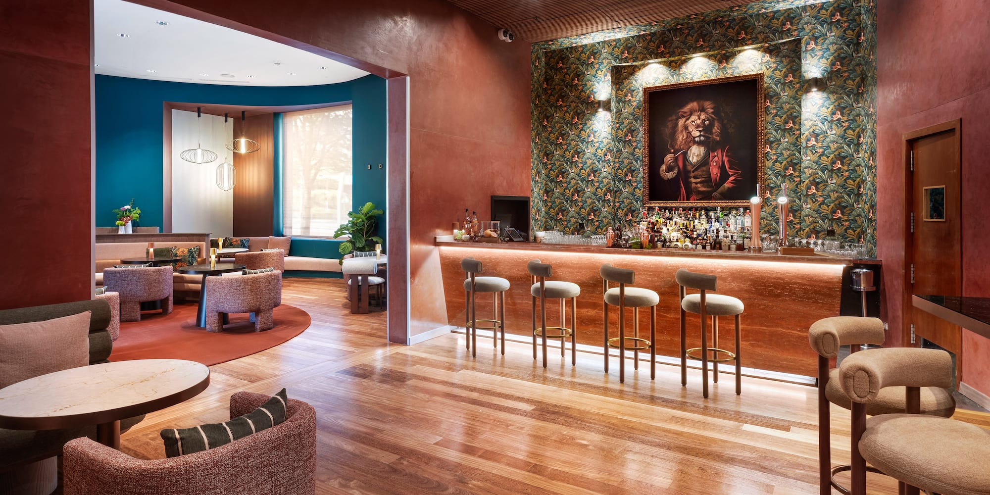 a room with a bar and chairs