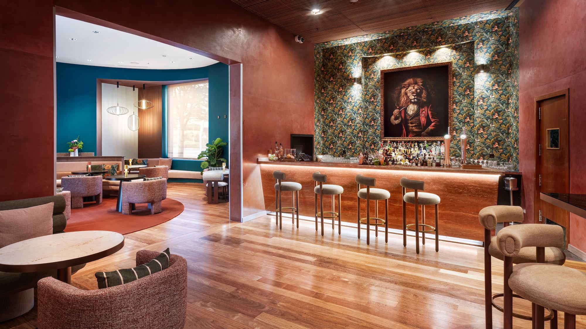 a room with a bar and chairs