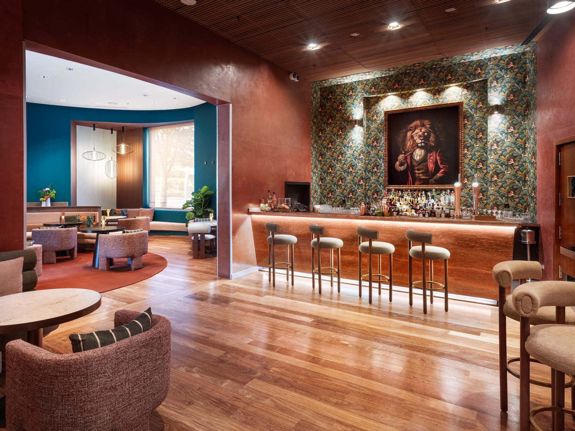 a room with a bar and chairs