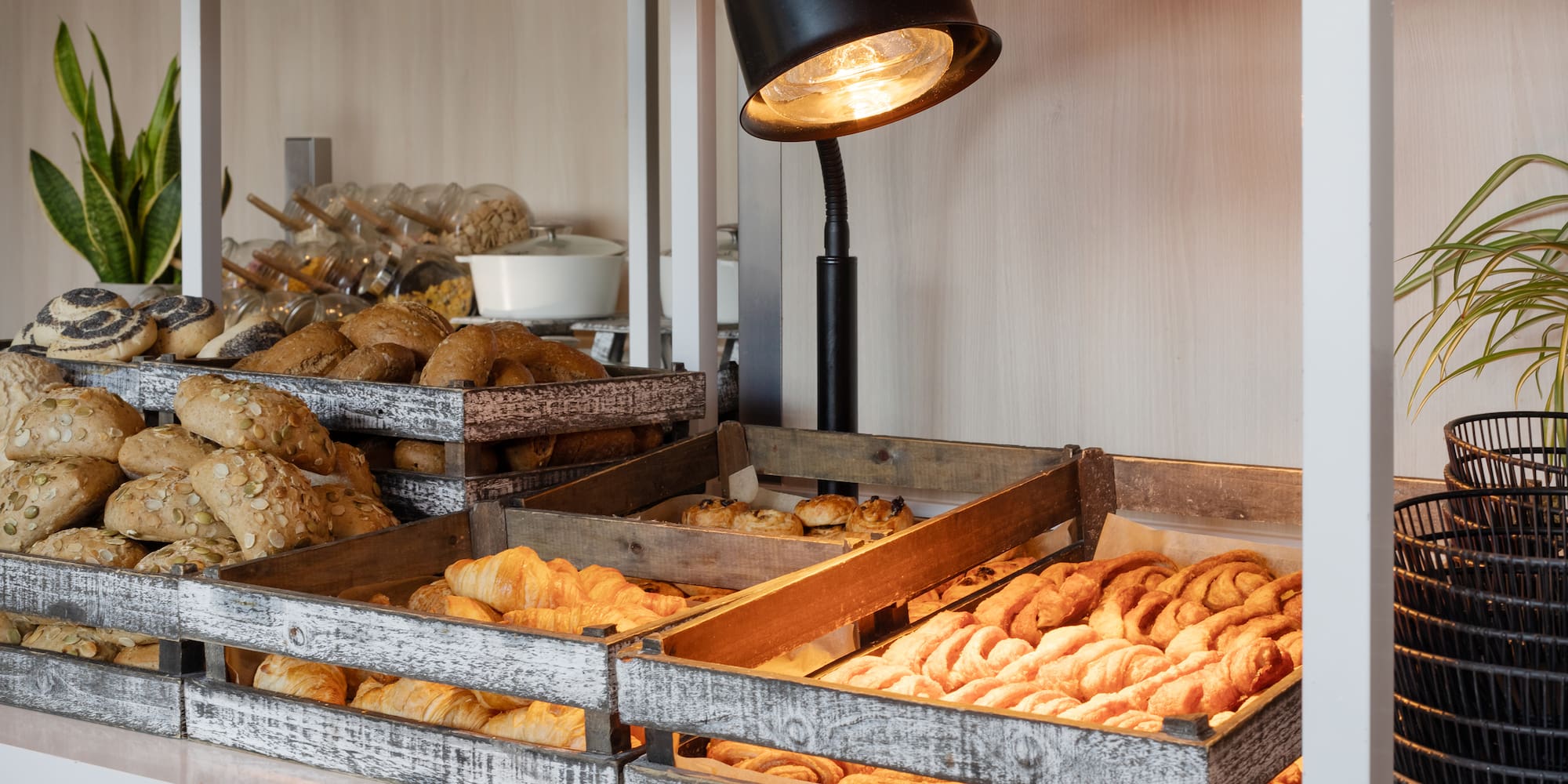 a trays of pastries and bread in a bakery