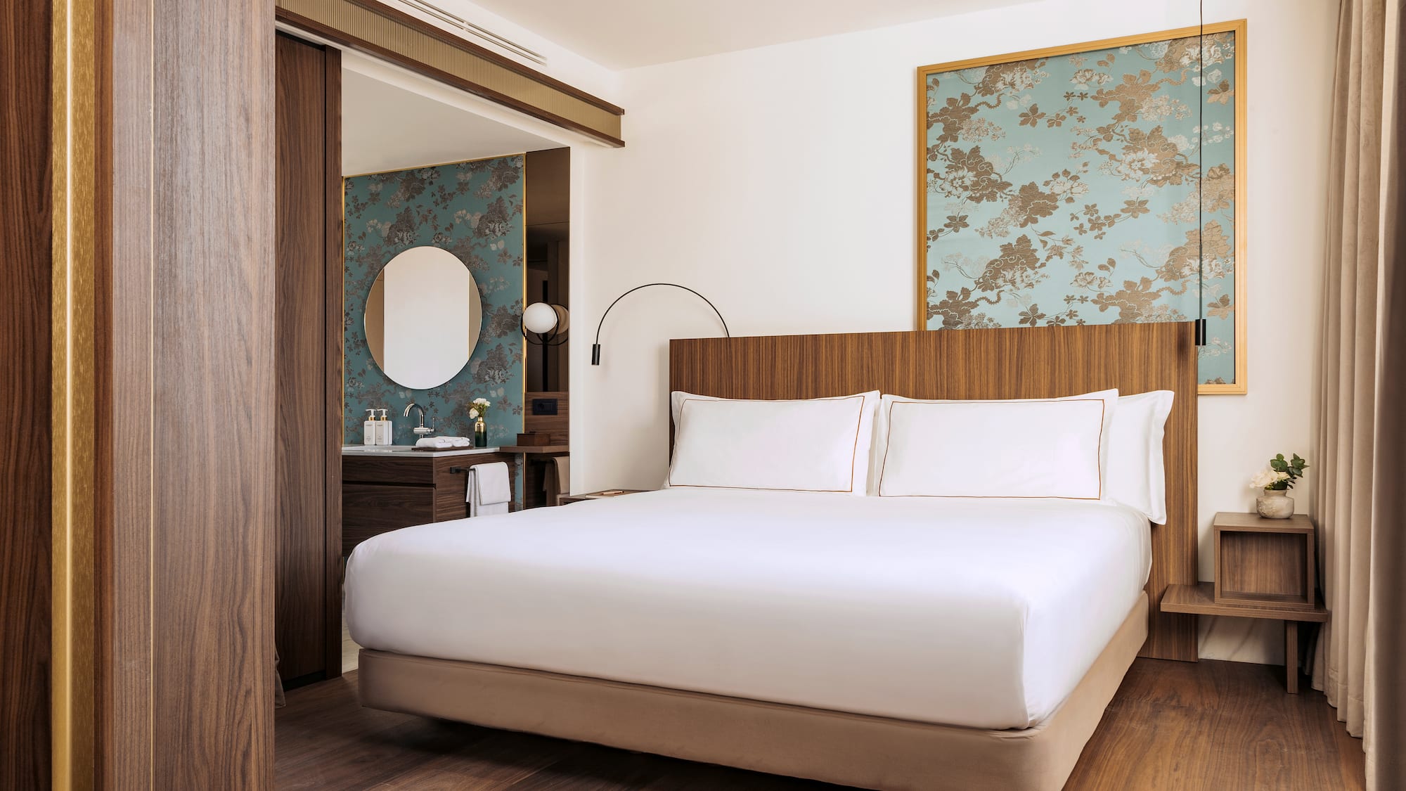 a bedroom with a bed and a mirror